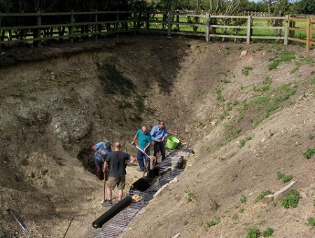 Volunteers construct gabions at Bugle Pit in 2012.